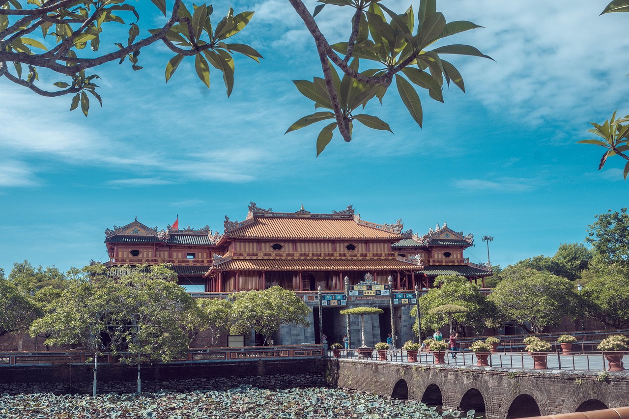 The Imperial City of Huế, with its typical red roofs, on the banks of a river
